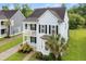 Charming home featuring dual porches, manicured landscaping, and a welcoming driveway at 2881 Rutherford Way, Charleston, SC 29414