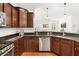 Kitchen featuring stainless steel appliances, granite countertops, and dark wood cabinets and view to an open floor plan at 2881 Rutherford Way, Charleston, SC 29414