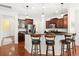 Modern kitchen features dark wood cabinetry, granite countertops, and stainless steel appliances at 2881 Rutherford Way, Charleston, SC 29414