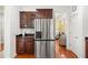 Modern kitchen with stainless steel refrigerator and stylish dark wood cabinets at 2881 Rutherford Way, Charleston, SC 29414