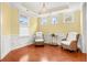 Inviting living room boasts hardwood floors, wainscoting detail, and recessed lighting at 2881 Rutherford Way, Charleston, SC 29414
