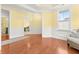 Well-lit living room displays hardwood floors and a tray ceiling at 2881 Rutherford Way, Charleston, SC 29414