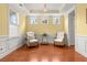 Bright living room with hardwood floors, decorative trim, and ample natural light at 2881 Rutherford Way, Charleston, SC 29414