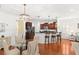 Open concept living area features a dining table, kitchen with bar seating, and easy flow for entertaining at 2881 Rutherford Way, Charleston, SC 29414