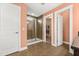 Main bathroom featuring tile floors, shower with glass door and walk-in closet at 2881 Rutherford Way, Charleston, SC 29414