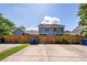 Backyard with a wooden fence and driveway at 2947 Sweetleaf Ln, Johns Island, SC 29455