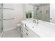 Modern bathroom featuring marble walls, quartz countertops, and a glass-enclosed shower at 2947 Sweetleaf Ln, Johns Island, SC 29455