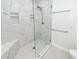 Clean and modern bathroom with a glass-enclosed shower, white marble walls, and sleek fixtures at 2947 Sweetleaf Ln, Johns Island, SC 29455