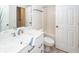 All white bathroom featuring marble countertops, white cabinets, and shower/tub combo at 2947 Sweetleaf Ln, Johns Island, SC 29455
