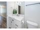 Bathroom with quartz countertops, a decorative plant, and brushed nickel hardware at 2947 Sweetleaf Ln, Johns Island, SC 29455