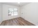 Cozy bedroom with laminate floors, a window for natural light, and a closet at 2947 Sweetleaf Ln, Johns Island, SC 29455