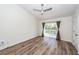 Spacious bedroom featuring hardwood floors, a ceiling fan, and balcony access through sliding glass doors at 2947 Sweetleaf Ln, Johns Island, SC 29455