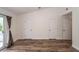A bright, airy bedroom features three doors, vaulted ceilings and wood-look flooring at 2947 Sweetleaf Ln, Johns Island, SC 29455