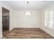 Open dining room with hardwood floors, chair rail and decorative trim, and stainless steel appliances visible at 2947 Sweetleaf Ln, Johns Island, SC 29455