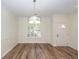 Bright dining room featuring hardwood floors, chandelier lighting fixture, and a window for natural light at 2947 Sweetleaf Ln, Johns Island, SC 29455