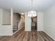 Bright, open-concept dining room with hardwood floors, modern lighting, and trimwork at 2947 Sweetleaf Ln, Johns Island, SC 29455