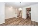Elegant dining room boasting hardwood floors, modern lighting, and easy access to the staircase at 2947 Sweetleaf Ln, Johns Island, SC 29455