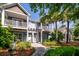 Two story townhouse with a walkway and porch, surrounded by luscious greenery at 2947 Sweetleaf Ln, Johns Island, SC 29455