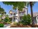 Charming two-story townhome with double balconies, lush landscaping, and inviting entryway at 2947 Sweetleaf Ln, Johns Island, SC 29455