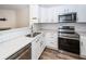 Modern kitchen with white cabinets, subway tile, stainless appliances and stone countertops at 2947 Sweetleaf Ln, Johns Island, SC 29455