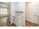 Bright butler's pantry with white cabinets and stone countertop at 2947 Sweetleaf Ln, Johns Island, SC 29455