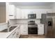 Modern kitchen featuring stainless appliances, white cabinetry and countertops, and subway tile backsplash at 2947 Sweetleaf Ln, Johns Island, SC 29455