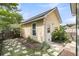 Detached one-car garage and charming backyard featuring lush landscaping and stepping stones at 2961 Waterleaf Rd, Johns Island, SC 29455