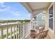 Scenic balcony with seating, offering serene waterfront views and a refreshing outdoor space at 2961 Waterleaf Rd, Johns Island, SC 29455