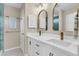 Elegant bathroom with double sink vanity, modern fixtures, and stylish mirrors at 2961 Waterleaf Rd, Johns Island, SC 29455