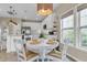 Eat-in dining area featuring a white table, pendant lighting, and bright windows at 2961 Waterleaf Rd, Johns Island, SC 29455