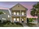 Attractive two-story home featuring a porch swing and double balconies, perfect for enjoying scenic views at 2961 Waterleaf Rd, Johns Island, SC 29455