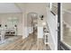 Inviting foyer with hardwood floors, elegant decor, and a staircase leading to the upper level of the home at 2961 Waterleaf Rd, Johns Island, SC 29455