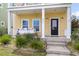 Welcoming front porch featuring a cozy porch swing and a well-manicured garden leading to the entrance at 2961 Waterleaf Rd, Johns Island, SC 29455