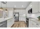 Bright kitchen featuring white cabinetry, stainless steel appliances, and an island with ample countertop space at 2961 Waterleaf Rd, Johns Island, SC 29455