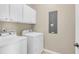 Well-equipped laundry room featuring modern white washer and dryer appliances at 2961 Waterleaf Rd, Johns Island, SC 29455