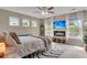 Bright bedroom with large windows, a ceiling fan, and a cozy fireplace at 2961 Waterleaf Rd, Johns Island, SC 29455