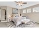 Relaxing bedroom featuring natural light, neutral colors, and a cozy decorative rug at 2961 Waterleaf Rd, Johns Island, SC 29455