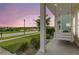 Scenic view from the porch, showcasing a serene lake and a relaxing porch swing for outdoor enjoyment at 2961 Waterleaf Rd, Johns Island, SC 29455