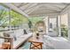 Relaxing screened-in porch with comfortable seating and views of the backyard at 2961 Waterleaf Rd, Johns Island, SC 29455