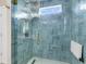 Luxurious shower with glass enclosure, blue tile, and modern fixtures at 2961 Waterleaf Rd, Johns Island, SC 29455