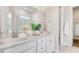 Bright bathroom featuring double vanity, quartz countertop, and large mirror and shower at 308 Archar St, Summerville, SC 29486