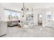Stylish bonus room with unique hanging chairs, modern lighting, and large windows at 308 Archar St, Summerville, SC 29486