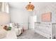 Serene Bedroom with patterned wallpaper, cozy crib, and comfortable seating at 308 Archar St, Summerville, SC 29486