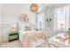 A charming bedroom with patterned wallpaper, a cozy bed, and a pendant light at 308 Archar St, Summerville, SC 29486