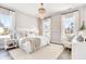 Serene main bedroom with a chandelier, large windows, and stylish furnishings at 308 Archar St, Summerville, SC 29486