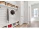 Organized mudroom featuring built-in storage, shiplap accent wall, and functional design at 308 Archar St, Summerville, SC 29486