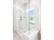 A luxurious, glass enclosed shower with white tile and modern fixtures at 308 Archar St, Summerville, SC 29486