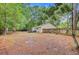 Spacious backyard with privacy fence and mature trees at 309 Kingbird Rd, Ladson, SC 29456