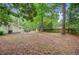 Expansive backyard with mature trees and ample space at 309 Kingbird Rd, Ladson, SC 29456