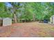 Large backyard with storage shed and established trees at 309 Kingbird Rd, Ladson, SC 29456